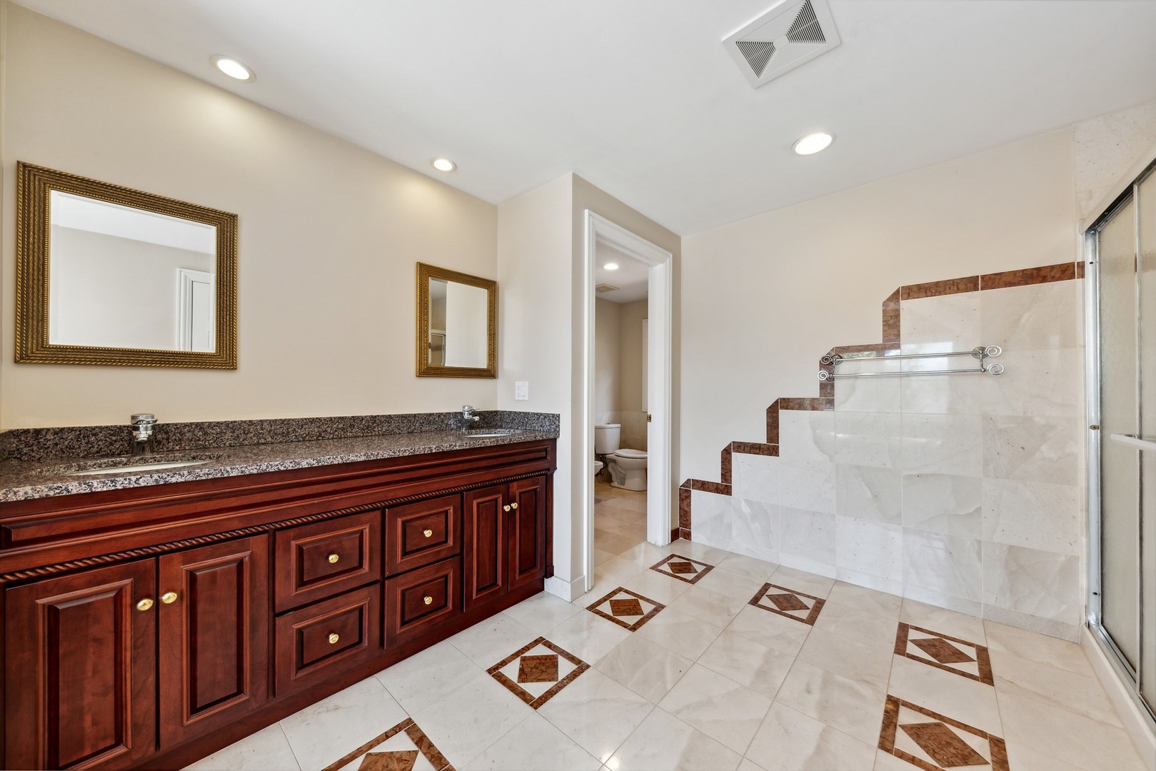 3080 Koepke Road Northbrook, IL 60062 - Photo 20 of 66 a spacious bathroom with a granite countertop sink a mirror and shower