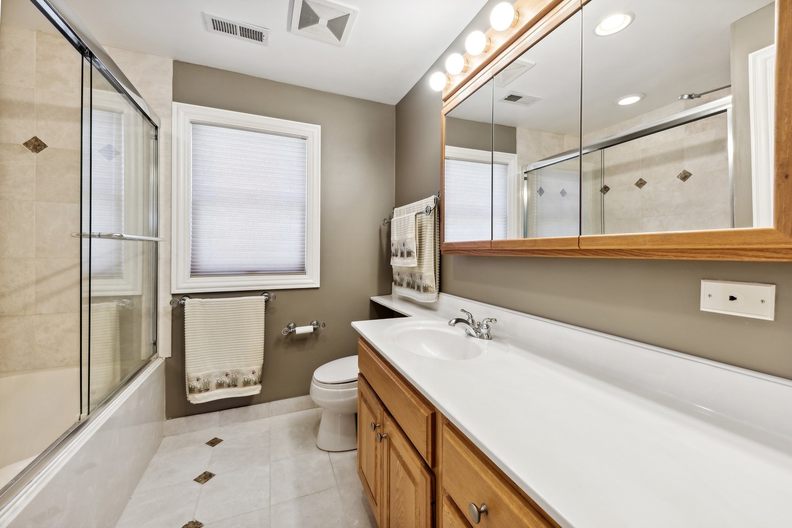 3080 Koepke Road Northbrook, IL 60062 - Photo 30 of 66 a bathroom with a double vanity sink mirror and toilet