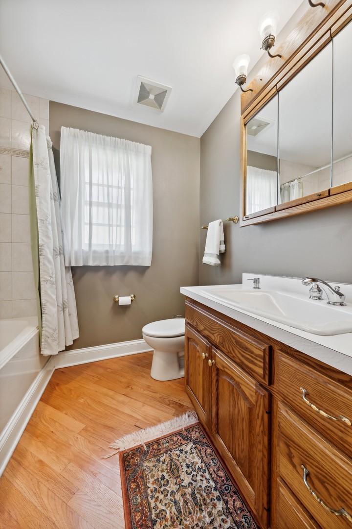 3080 Koepke Road Northbrook, IL 60062 - Photo 32 of 66 a bathroom with a sink toilet and mirror