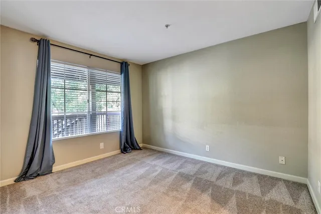 a view of a kitchen with refrigerator