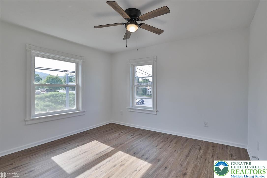 1660 Main Street Hellertown, PA 18055 - Photo 15 of 30 a view of an empty room with window and wooden floor