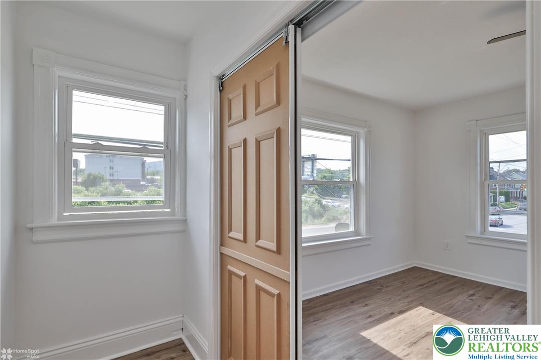 1660 Main Street Hellertown, PA 18055 - Photo 16 of 30 an empty room with wooden floor and windows