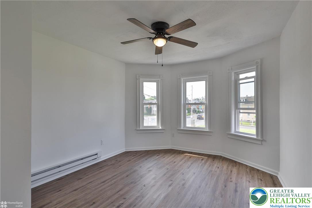 1660 Main Street Hellertown, PA 18055 - Photo 17 of 30 a view of an empty room with wooden floor and a window