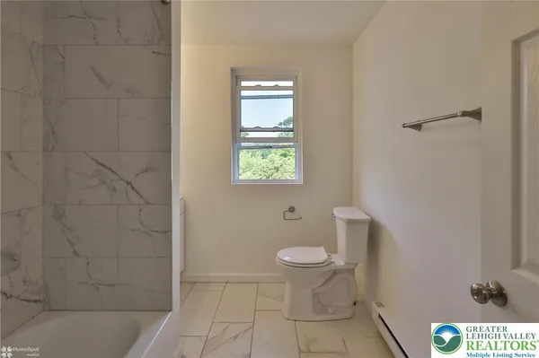 a bathroom with a toilet