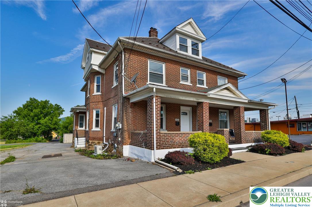 1660 Main Street Hellertown, PA 18055 - Photo 2 of 30 a front view of a house with garden