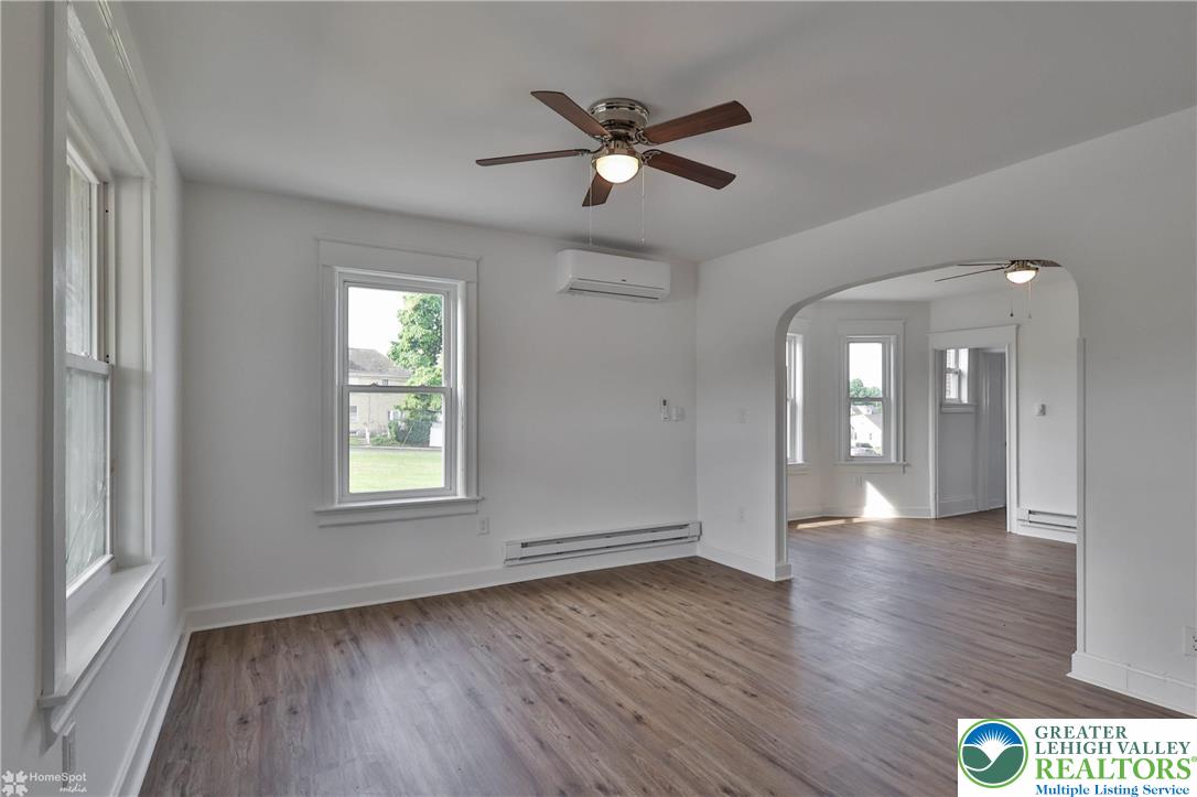 1660 Main Street Hellertown, PA 18055 - Photo 5 of 30 a view of an empty room with wooden floor and a window