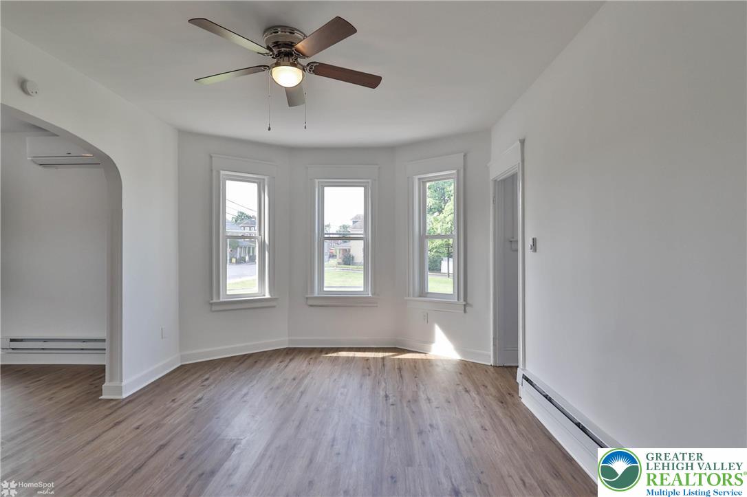 1660 Main Street Hellertown, PA 18055 - Photo 8 of 30 wooden floor in an empty room with a window
