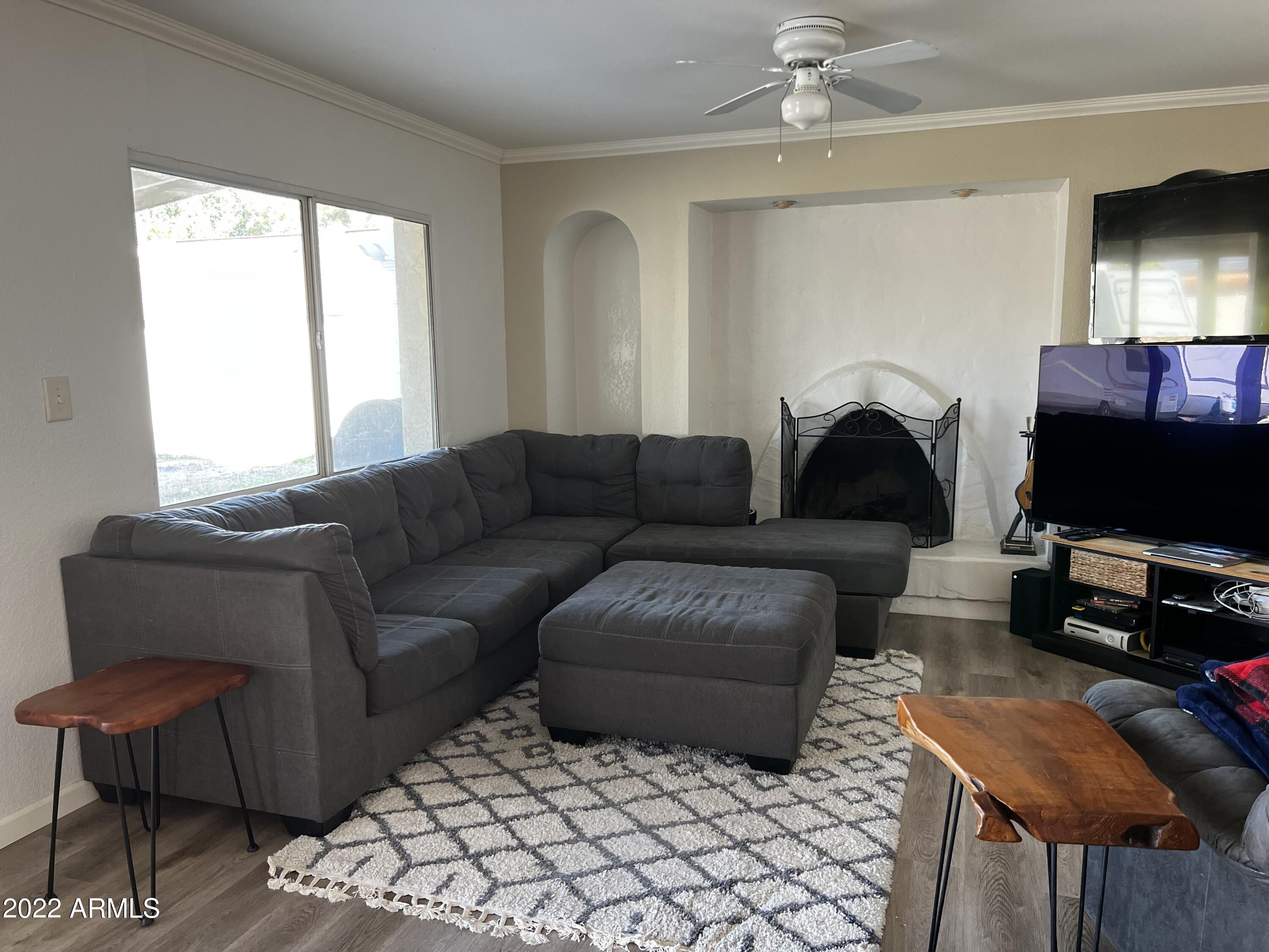 4634 West Calavar Road Glendale, AZ 85306 - Photo 13 of 26 Family Room with Fireplace