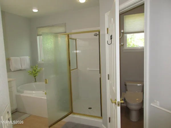 a bathroom with a bathtub a sink and a mirror