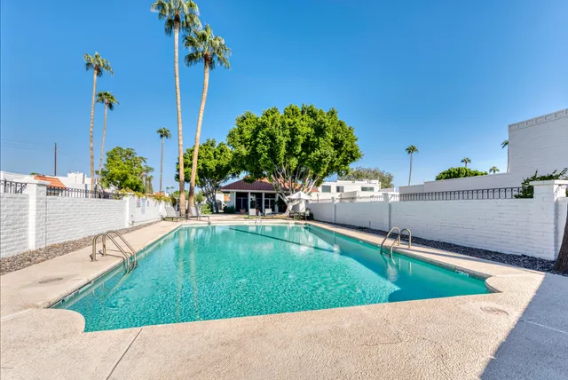 a view of a swimming pool with a patio