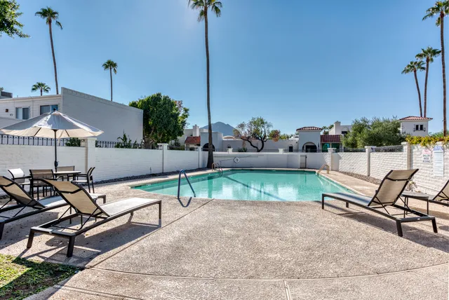 a view of chairs and tables in the patio