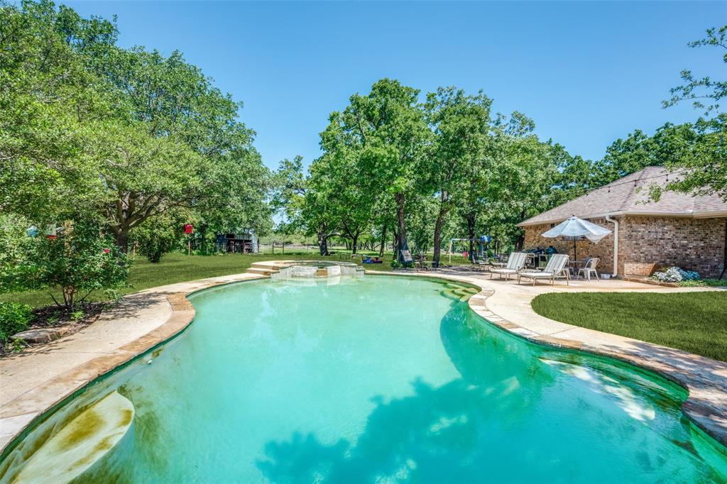 778 County Road 3141 Decatur, TX 76234 - Photo 24 of 25 a swimming pool with outdoor seating and yard