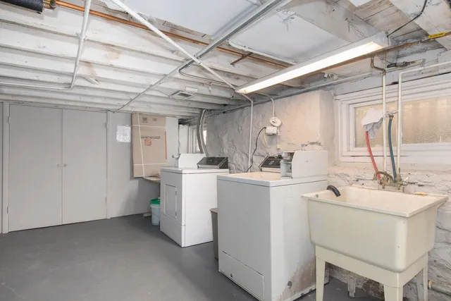 a room with sink and washing machine