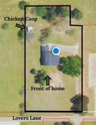 a view of a yard with large trees