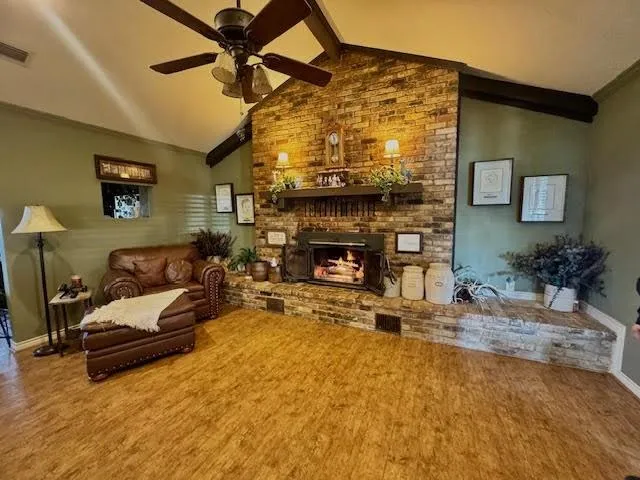 a view of a patio with table and chairs and potted plants