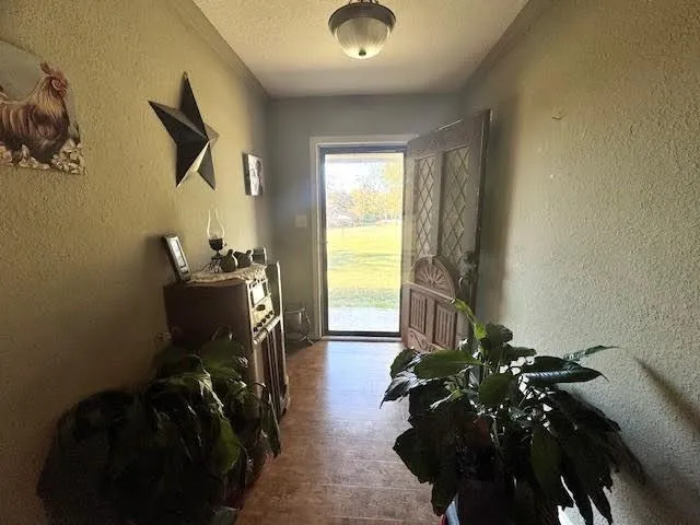 a bedroom with a bed dresser and a window