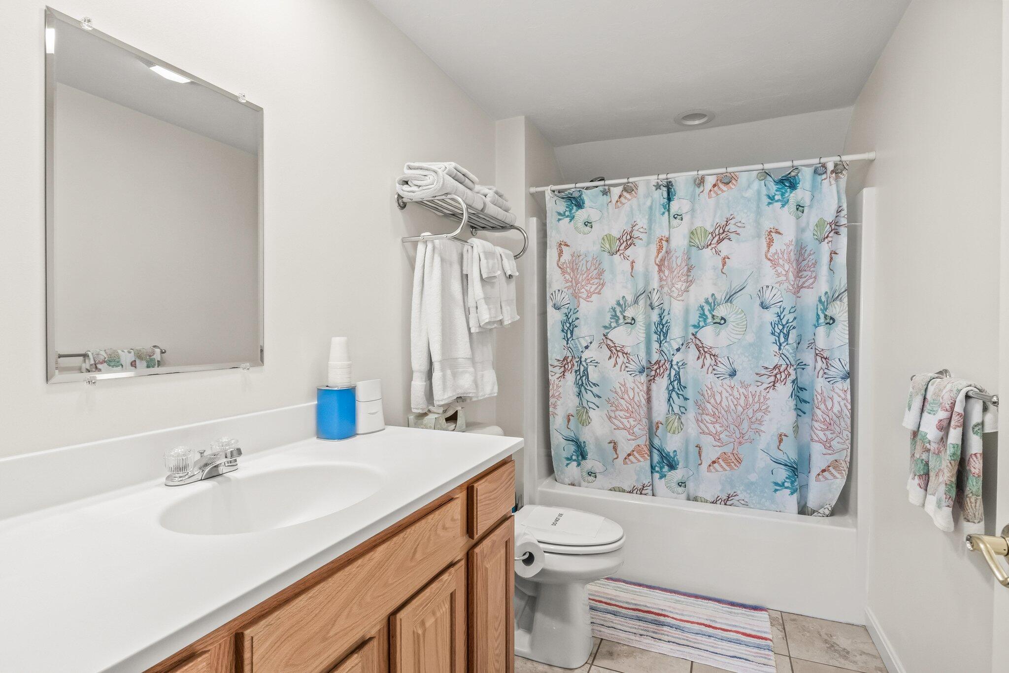 22 North Ridge Road Mashpee, MA 02649 - Photo 28 of 33 a bathroom with a sink a toilet and a large mirror