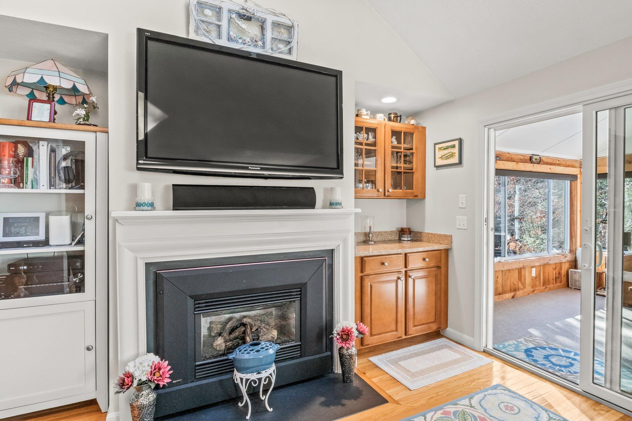 22 North Ridge Road Mashpee, MA 02649 - Photo 9 of 33 a living room with furniture and a fireplace