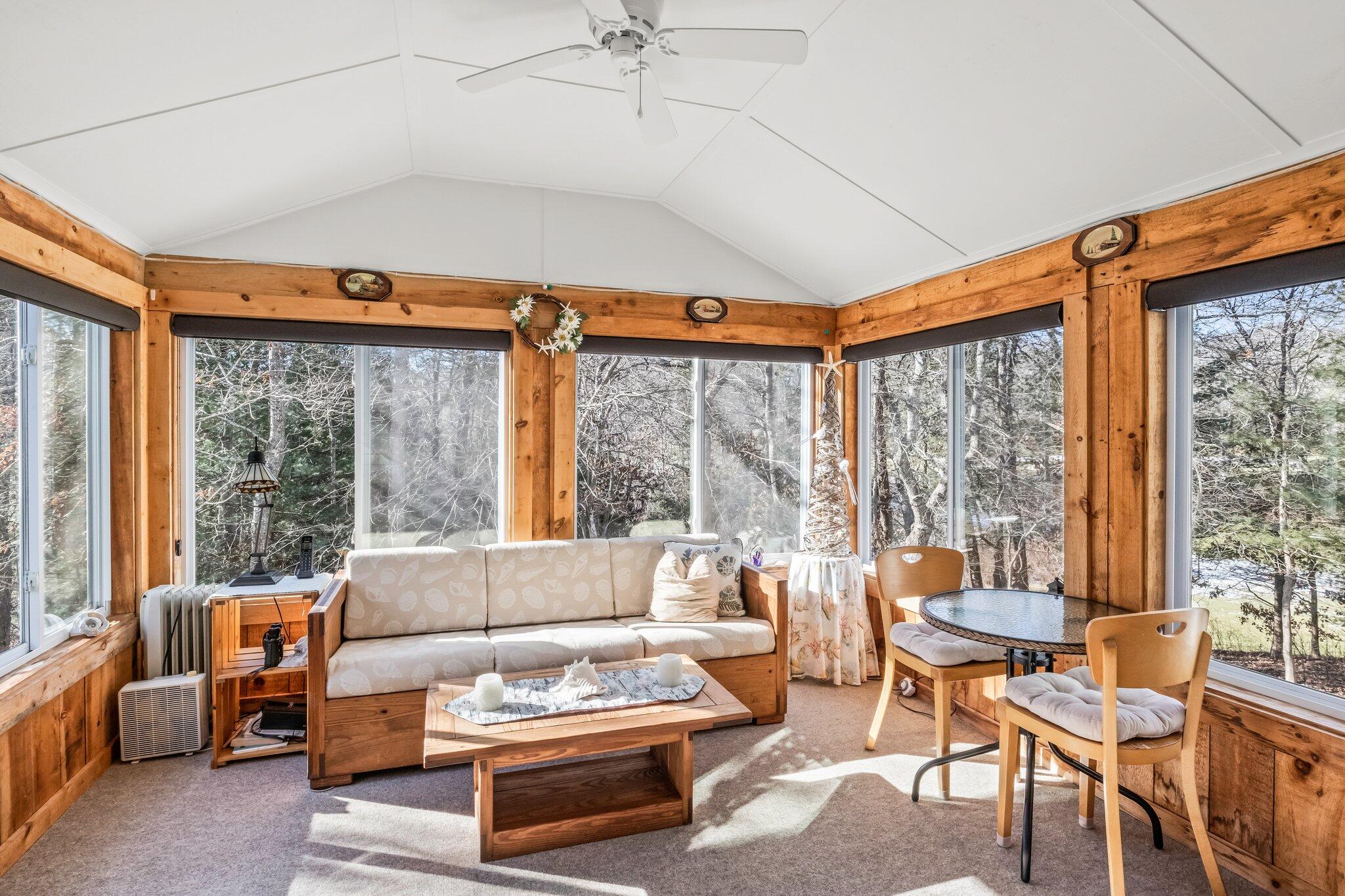 22 North Ridge Road Mashpee, MA 02649 - Photo 10 of 33 a living room with furniture a table and a large window