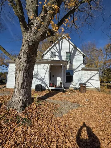 a view of a house with a snow in a yard