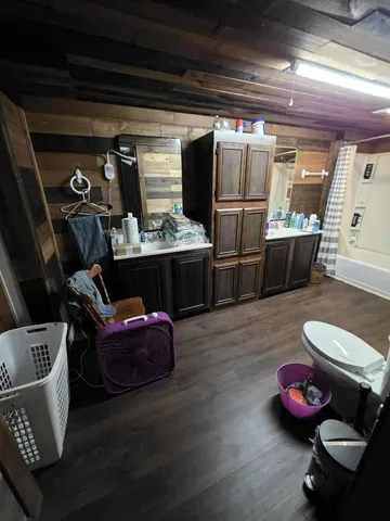 a bed sitting in a room next to a window