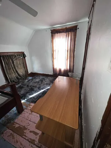 a view of an empty room and window