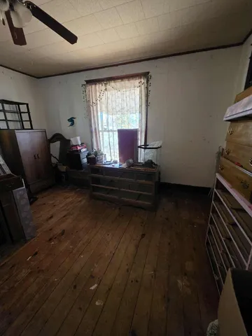 a room with water heater and a cabinet