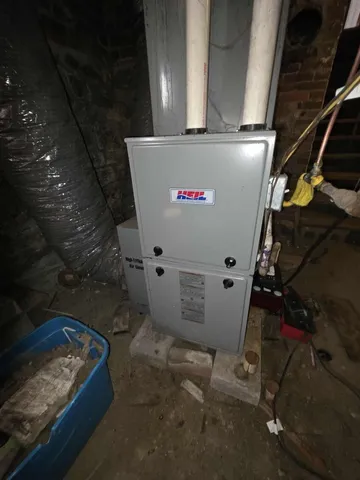 a backyard of a building with large trees