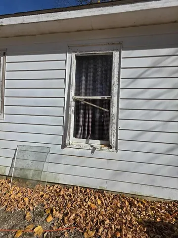 a view of a backyard of the house