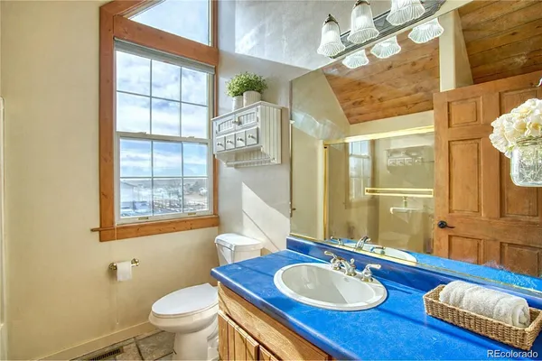 a bathroom with 2 sink tub and a mirror