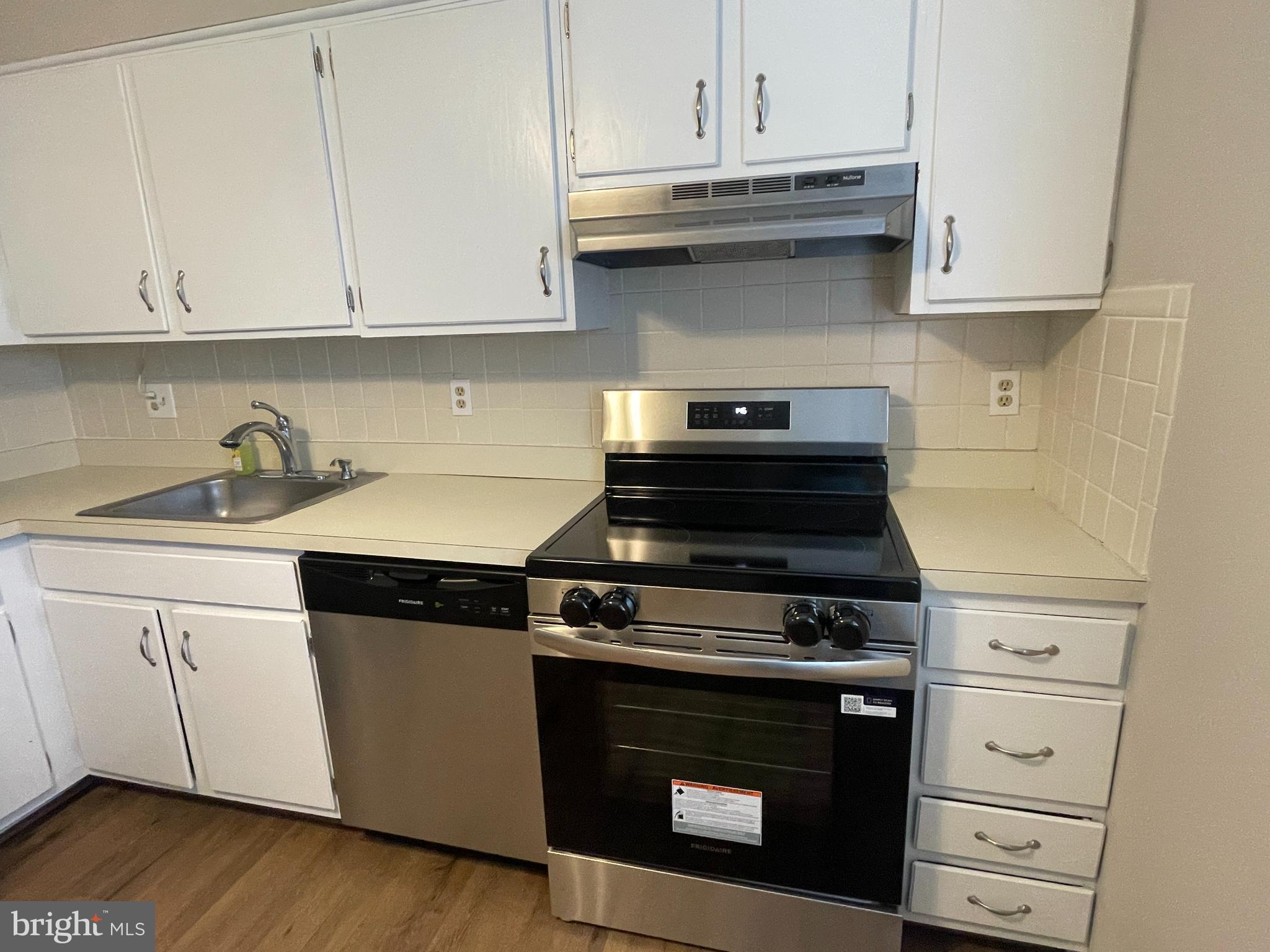 7944 Tick Neck Road Pasadena, MD 21122 - Photo 6 of 40 a stove top oven sitting inside of a kitchen