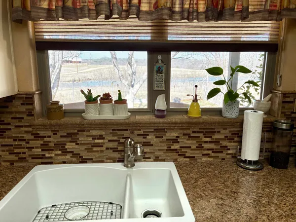 a kitchen with a sink and a stove