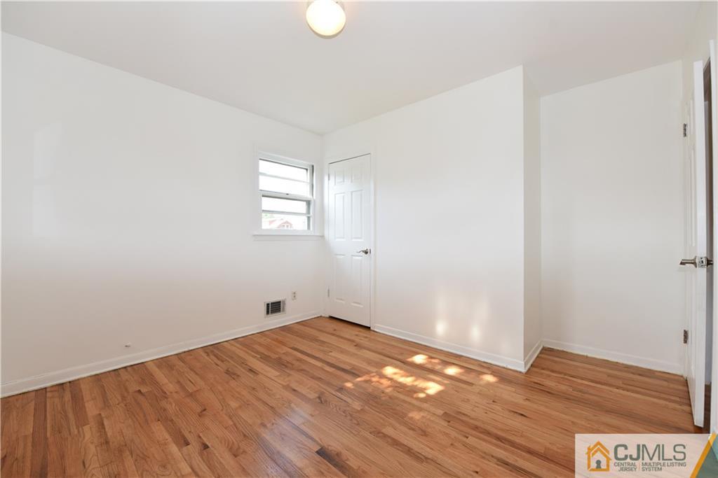214 3rd Street Middlesex, NJ 08846 - Photo 13 of 22 a view of empty room with wooden floor