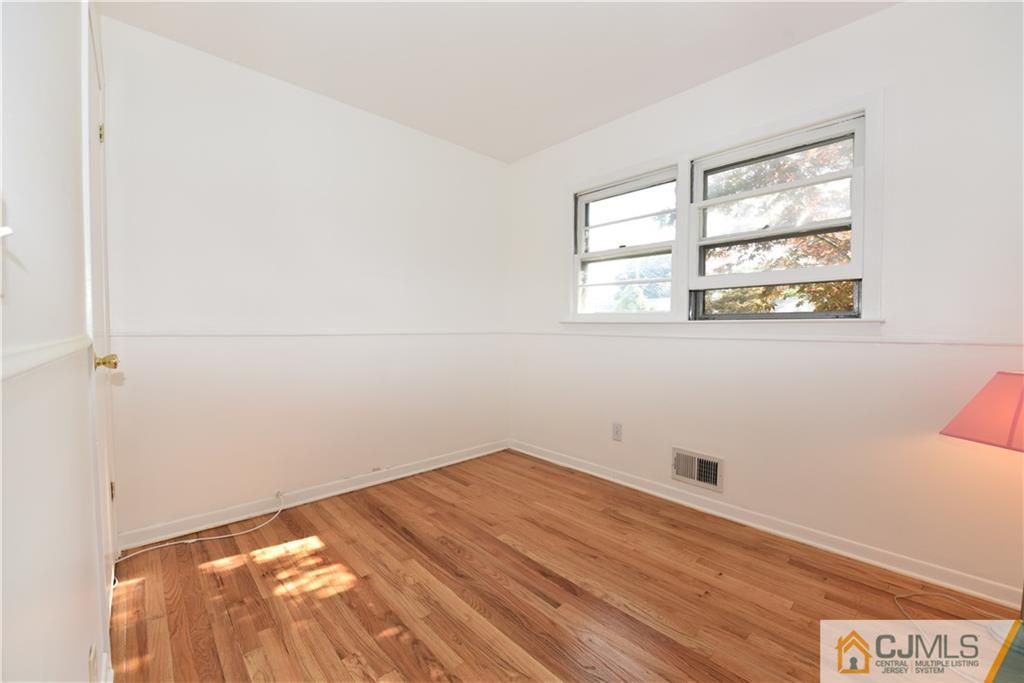 214 3rd Street Middlesex, NJ 08846 - Photo 14 of 22 an empty room with a window