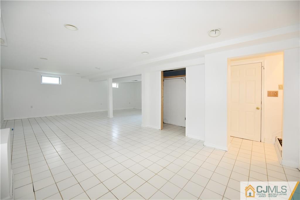 214 3rd Street Middlesex, NJ 08846 - Photo 18 of 22 a view of an empty room and window