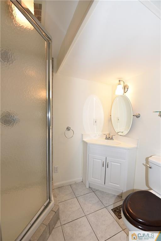 214 3rd Street Middlesex, NJ 08846 - Photo 19 of 22 a bathroom with a sink a toilet and shower