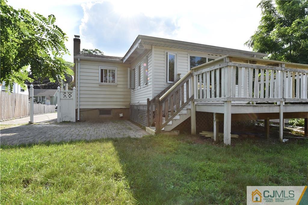 214 3rd Street Middlesex, NJ 08846 - Photo 22 of 22 a view of a house with a yard and deck