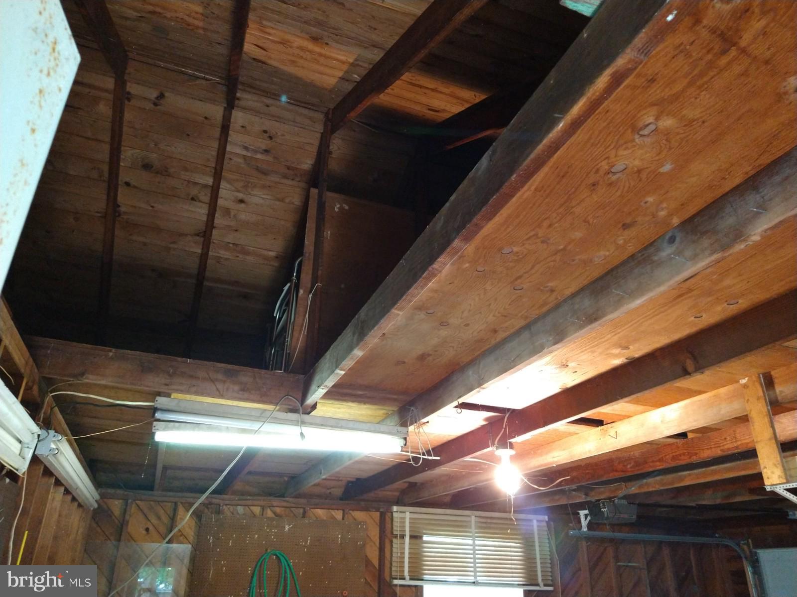 18255 River Road Tall Timbers, MD 20690 - Photo 36 of 39 Loft/floored storage over the garage