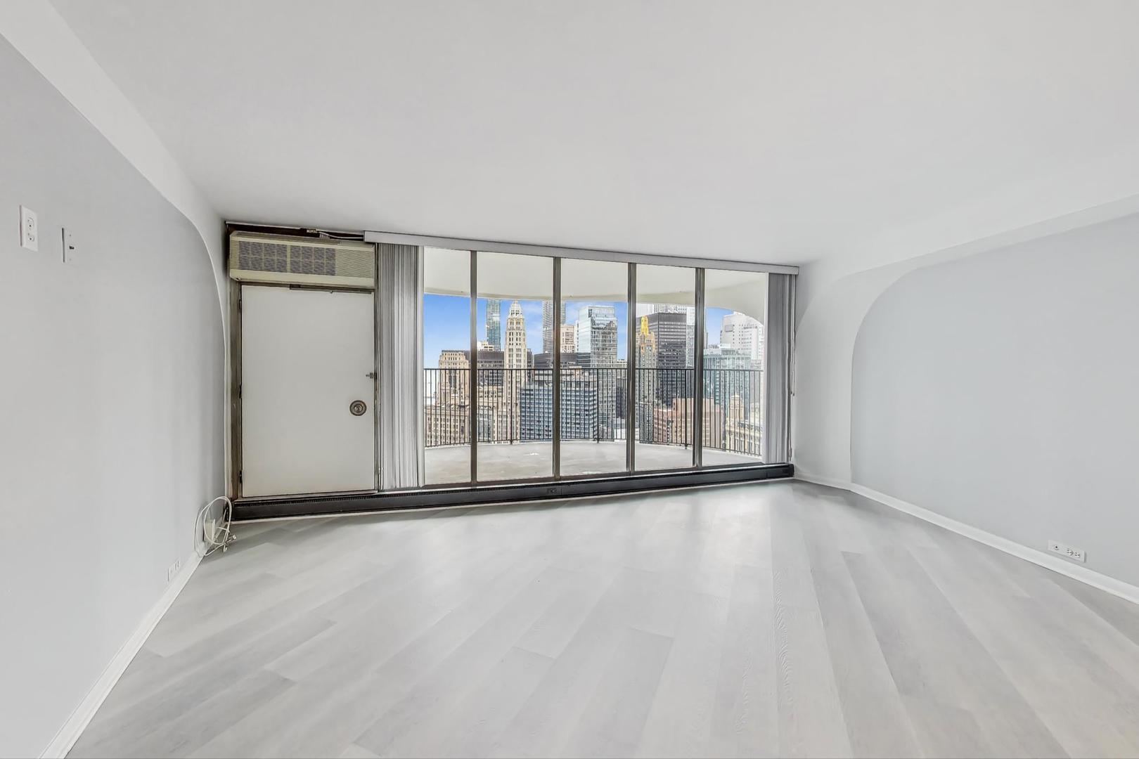 300 North State Street, Unit 4308 Chicago, IL 60654 - Photo 5 of 32 a view of an empty room with glass door