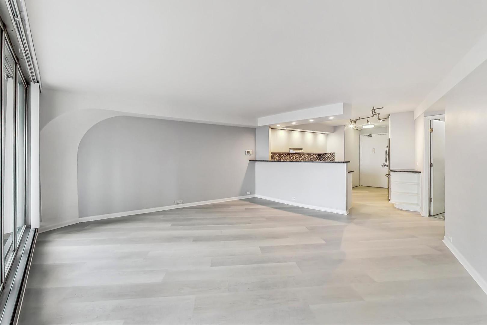 300 North State Street, Unit 4308 Chicago, IL 60654 - Photo 7 of 32 a view of a kitchen with a cabinet and a refrigerator