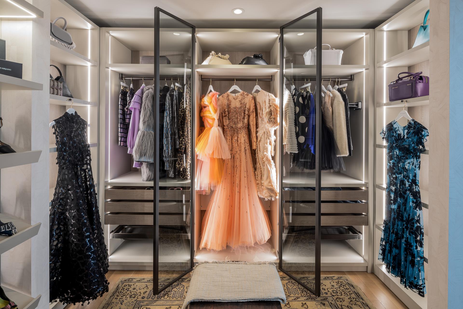 53 West 53rd Street, Unit PH78 Manhattan, NY 10019 - Photo 11 of 17 a view of walk in closet with clothes and shoes