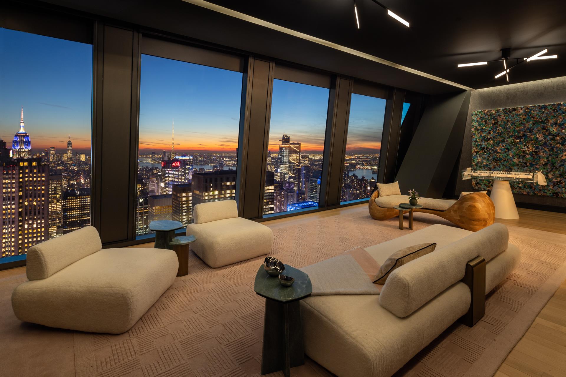 53 West 53rd Street, Unit PH78 Manhattan, NY 10019 - Photo 6 of 17 a living room with furniture and a floor to ceiling window