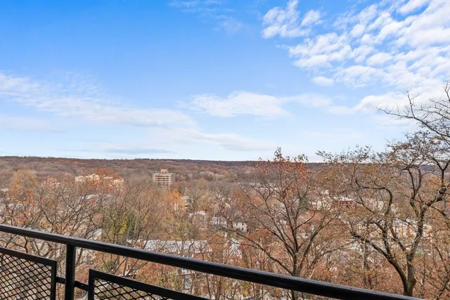 a view of a balcony with city view