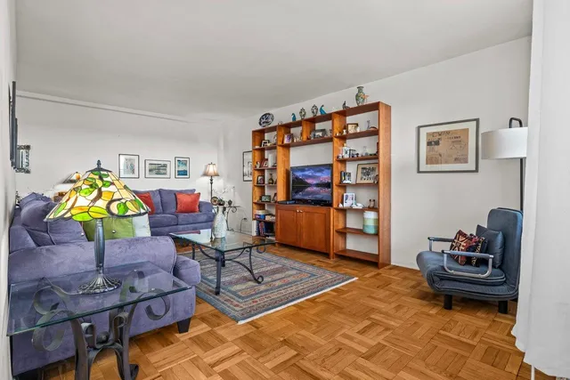 a living room with furniture a rug and a couch