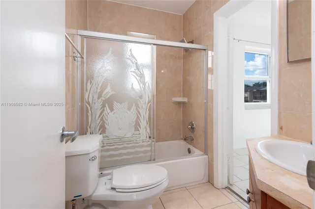 a bathroom with a toilet and a bathtub