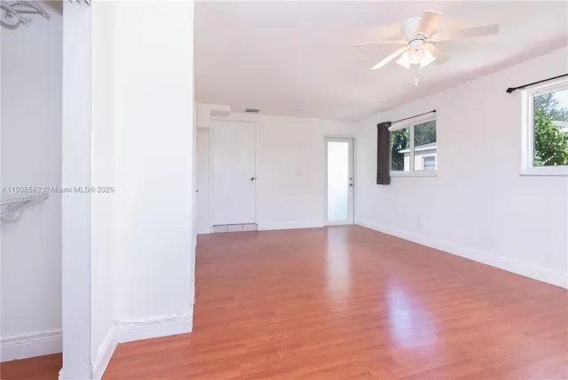 a view of an empty room with a window
