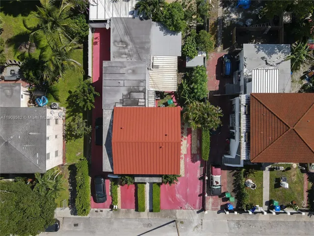 an aerial view of multiple houses with outdoor space