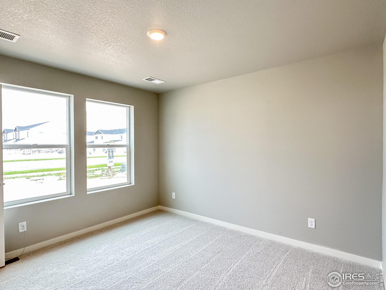 533 Bridger Avenue Fort Lupton, CO 80621 - Photo 9 of 9 an empty room with a window