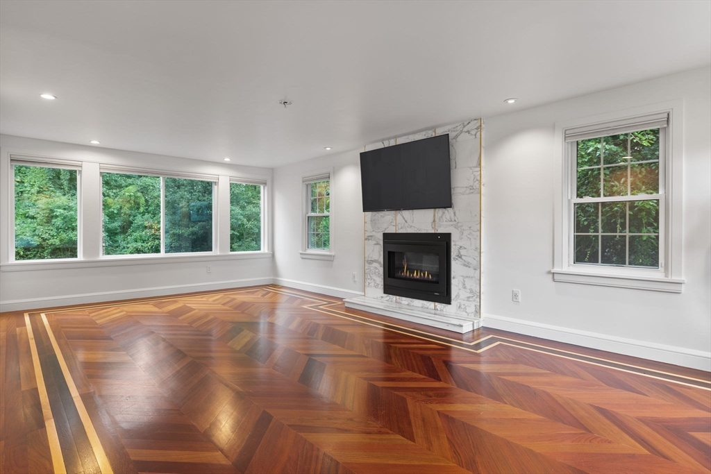4 Hadley Road Lexington, MA 02420 - Photo 11 of 35 a view of empty room with fireplace and fan