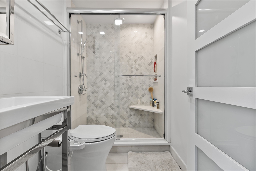 4 Hadley Road Lexington, MA 02420 - Photo 20 of 35 a bathroom with a shower a toilet and a shower